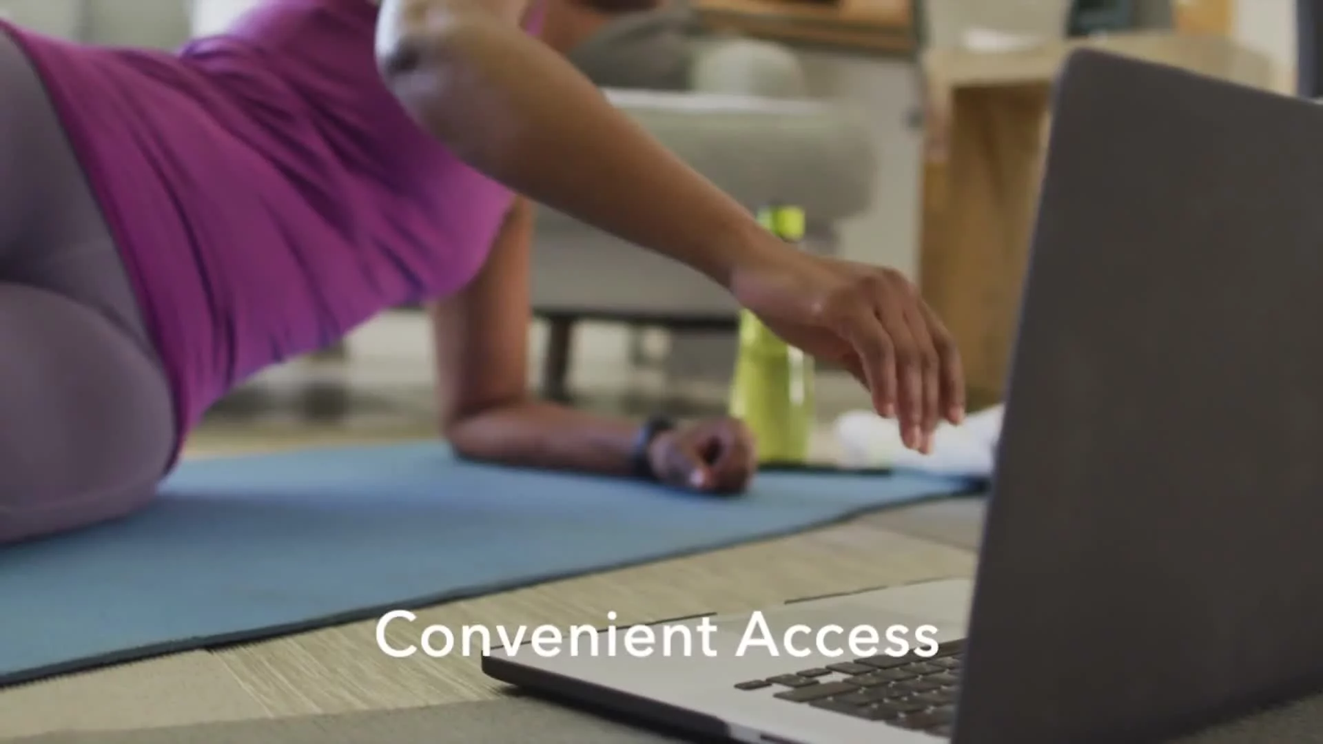 Person lying on exercise mat reaching toward open laptop with "Convenient Access" text.